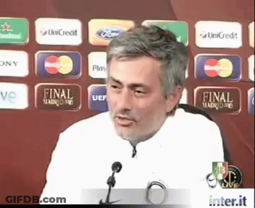 Man Giving Speech In Front Of Final Madrid 90 Sign GIF
