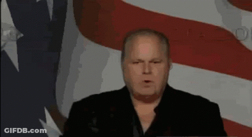 Man Giving Speech In Front Of Flag GIF