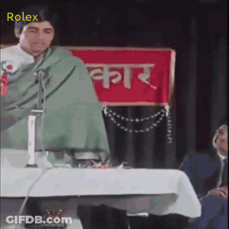 Man Giving Speech In Front Of Rolex Banner GIF