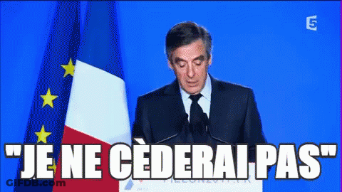 Man Giving Speech With Je Ne Cederai Pas GIF