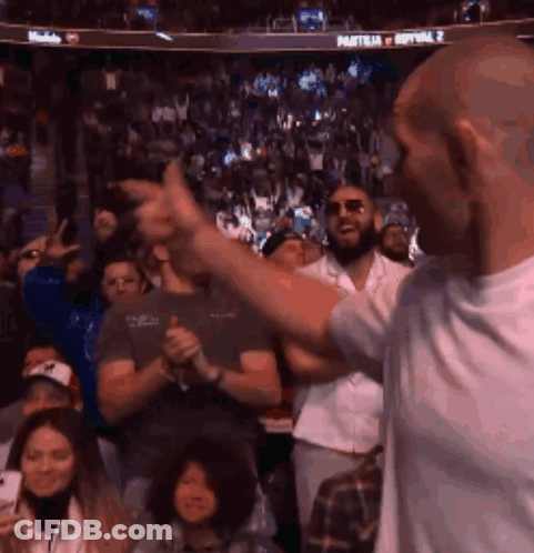 Man Giving Thumbs Up At Sports Event GIF