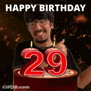 Man Giving Thumbs Up In Front Of 29 Birthday Cake GIF