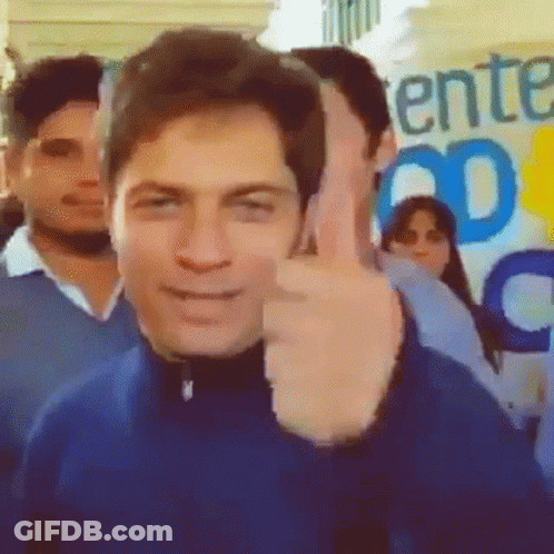 Man Giving Thumbs Up In Front Of Ent Sign GIF
