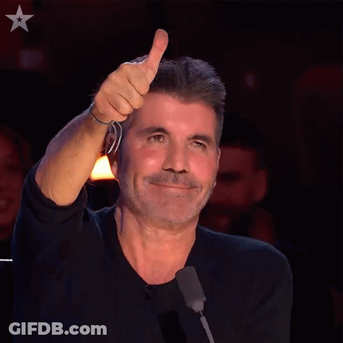 Man Giving Thumbs Up In Front Of Microphone GIF