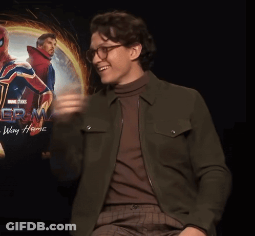 Man Giving Thumbs Up In Front Of Spider-Man Way Home Poster GIF