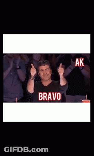 Man Giving Thumbs Up With Bravo Screen GIF