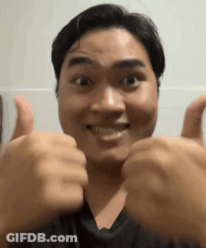 Man Giving Two Thumbs Up And Smiling GIF