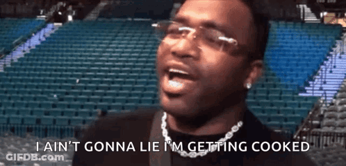 Man Glasses Chain Says Im Getting Cooked GIF