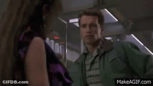Man Green Jacket Next To Woman Purple Shirt GIF