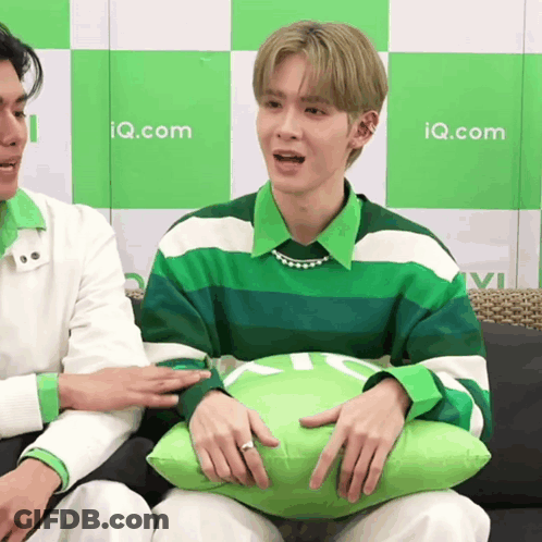 Man Green White Striped Shirt Holding Pillow Iq.com GIF