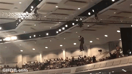 Man Hanging From Ceiling GIF