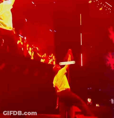Man Hanging From Rope On Stage GIF