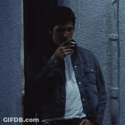 Man Hanging From Rope With Evil Written Below GIF