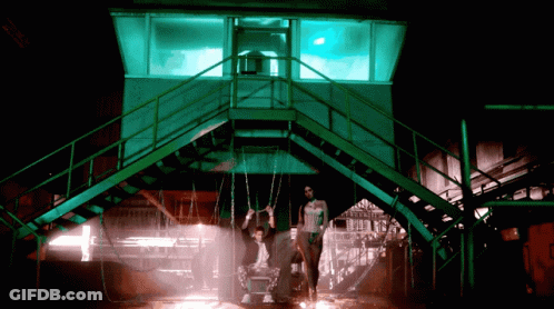 Man Hanging From Swing Chain GIF