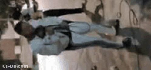 Man Hanging Upside Down With Microphone GIF
