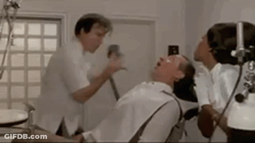 Man Having Dental Exam With Dentist And Nurse GIF