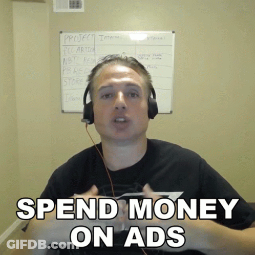 Man Headphones Says Spend Money On Ads Whiteboard GIF
