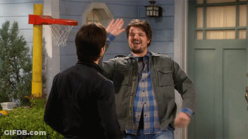 Man High-Fiving Another Man At Basketball Hoop GIF