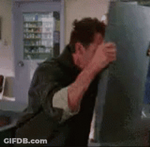 Man Hitting Head On Wood GIF