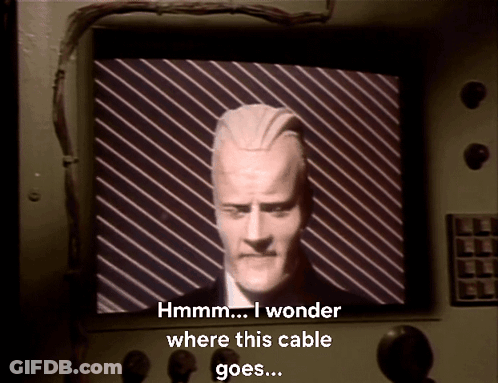 Man Hmm I Wonder Where This Cable Goes GIF