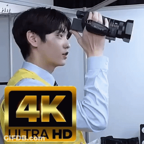 Man Holding 4K Ultra HD Camera GIF