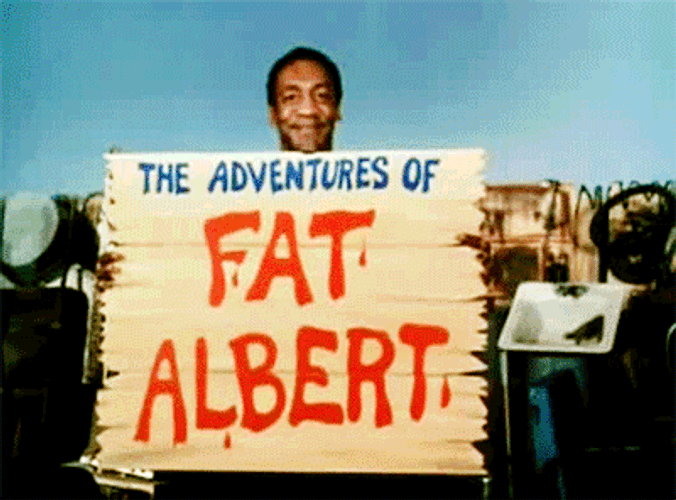 Man Holding A Fat Albert Poster GIF