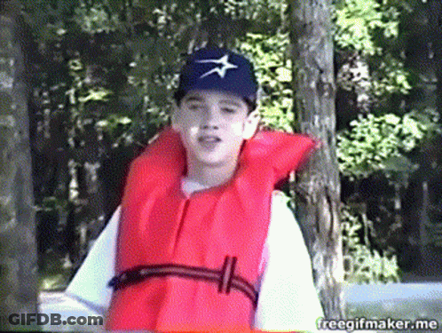 Man Holding American Flag In Crowd GIF