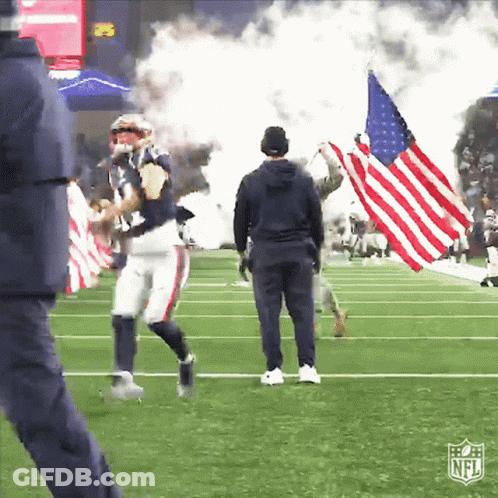 Man Holding American Flag On Field With NFL Logo GIF
