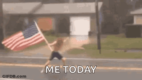 Man Holding American Flag On Roadside GIF