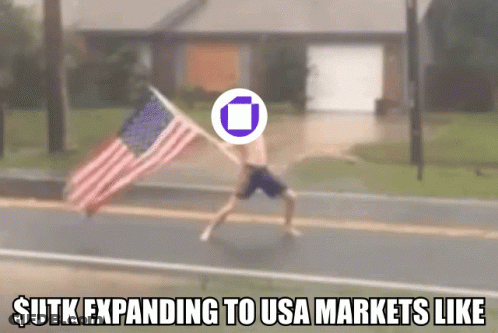 Man Holding American Flag $ Utk Expanding To Markets GIF