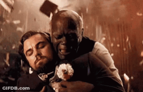 Man Holding Another Man's Head With Flying Hammer GIF