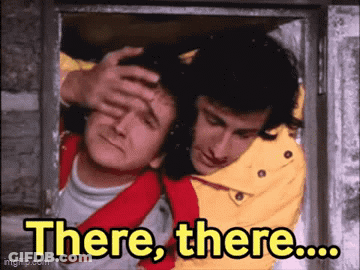 Man Holding Another's Head Saying There, There GIF