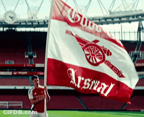 Man Holding Arsenal Flag GIF