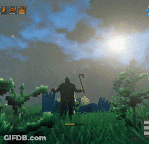 Man Holding Axe In Grass GIF