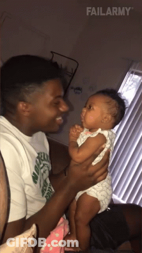 Man Holding Baby GIF