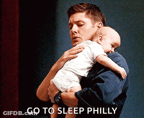 Man Holding Baby Go To Sleep Philly GIF