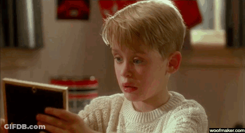 Man Holding Baby In Front Of Mirror GIF