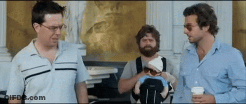 Man Holding Baby In Stroller GIF