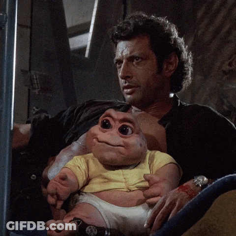 Man Holding Baby-Like Stuffed Animal GIF