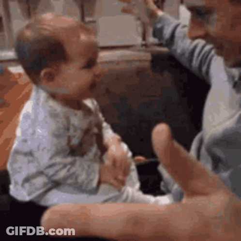 Man Holding Baby GIF