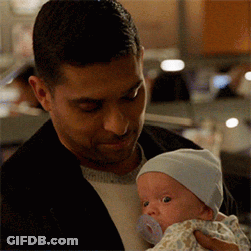 Man Holding Baby With Pacifier GIF