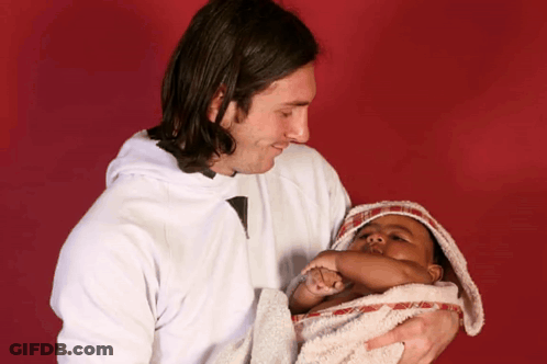 Man Holding Baby Wrapped In Towel GIF