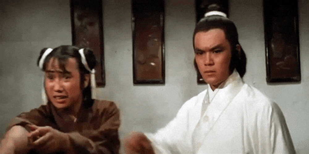 Man Holding Back His Companion GIF