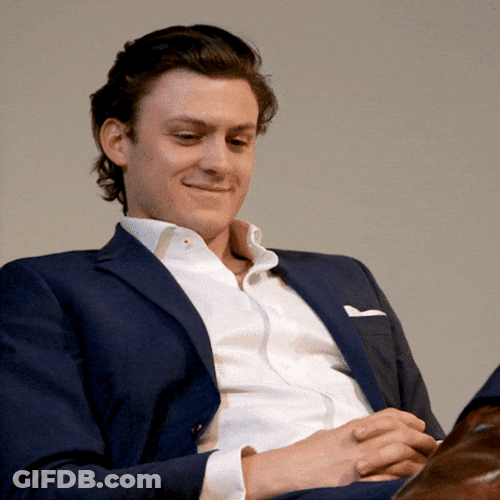 Man Holding Back His Laugh GIF