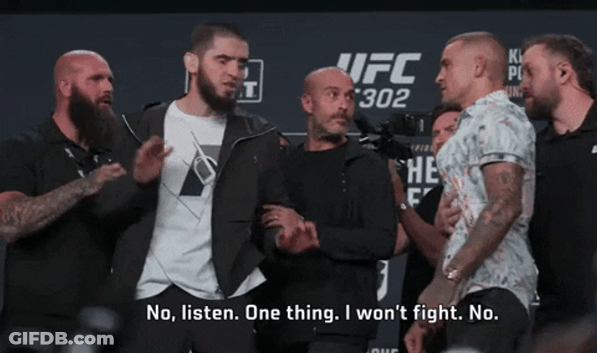 Man Holding Back His Self To Fight GIF