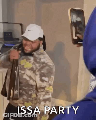 Man Holding Bag Photographing Another Man GIF