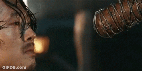 Man Holding Barbed Wire Bat In Mouth GIF