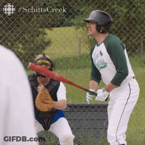Man Holding Baseball Bat In Front Of Fence #Schitts Creek GIF