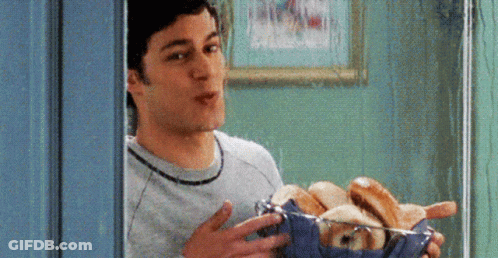 Man Holding Basket Of Hot Dogs And Bread GIF