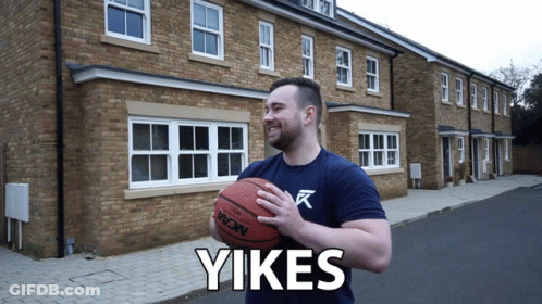 Man Holding Basketball In Front Of Brick Building Saying Yikes GIF